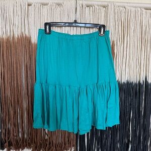 Turquoise mini skirt with ruffles; good condition